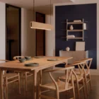 Singular Lighting - NINA Pendant P120-20 Modern linear wooden suspension lamp illuminating a dining area in a cabin with high ceilings and forest views