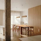 Singular Lighting - NINA Pendant P68-02 Warm LED light from a linear wooden pendant lamp contrasting with dark modern kitchen cabinetry